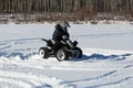 Child Driving a Quad in the Snow