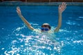 Child drowning in to the water and show up hands for help Royalty Free Stock Photo