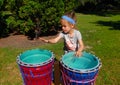 A child at a drum display in southern ontario Royalty Free Stock Photo