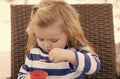 Child eat ice cream in cup with spoon Royalty Free Stock Photo