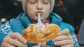 Child eat pizza cheese four. Close up of young girl woman eating pizza and chewing in outdoor restaurant. Kid children