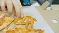 Child eat pizza and french fry potato. Close up of young girl woman eating pizza and chewing in outdoor restaurant. Royalty Free Stock Photo