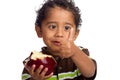 Child Eating Apple and Giving Thumb Up