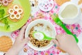 Child eating breakfast cereals with nuts, raisins, candied fruit Royalty Free Stock Photo