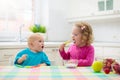 Child eating breakfast. Kid with milk and cereal Royalty Free Stock Photo