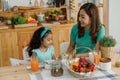 Child eating breakfast. Kid with milk and cereal and orange juice Royalty Free Stock Photo