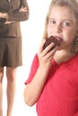 Child eating brownie - mom not Royalty Free Stock Photo