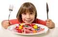 Child eating candy like crazy in sugar abuse and unhealthy sweet nutrition concept Royalty Free Stock Photo