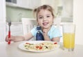 Child eating,caucasian little girl portrait,.small kid have a meal.Healthy nutrition Royalty Free Stock Photo