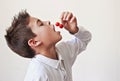 Child eating cherries