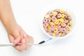 The child is eating cornflakes. Child`s hand with a spoon. Selective focus Royalty Free Stock Photo