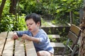 Child eating green peas at garden Royalty Free Stock Photo