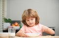 Child eating healthy food. Cute little boy having soup for lunch. Royalty Free Stock Photo