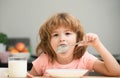 Child eating healthy food. Cute little boy having soup for lunch. Child nutrition. Royalty Free Stock Photo