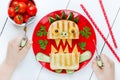 Child eating monster sandwich for breakfast. Funny idea for schoolboy food Royalty Free Stock Photo