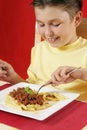 Child eating pasta Royalty Free Stock Photo