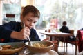 Child eating pasta with cheese Royalty Free Stock Photo