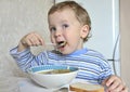 Child eating soup