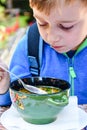 Child eating a soup Royalty Free Stock Photo