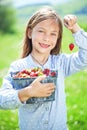 Child eating strawberries in a field Royalty Free Stock Photo