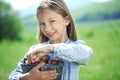 Child eating strawberries in a field Royalty Free Stock Photo