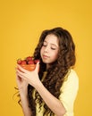 Child eating strawberry. Dessert sweet food. Buy red berry. My summer pleasure. Girl eating homegrown strawberry