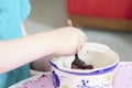 Child eating sweets pudding desert chocolate cake young kid girl with spoon and dish unhealthy Royalty Free Stock Photo