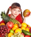 Child eating vegetable and fruit.