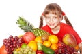 Child eating vegetable and fruit.