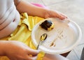 Child eats a chocolate cake. Fat and overweight concept