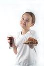 Young girl eating pizza and drinking an ice drink.