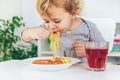 The child eats spaghetti lunch. Selective focus. Royalty Free Stock Photo