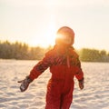 Child enjoying the falling snow