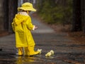 Child Enjoying The Rain In His Galoshes Royalty Free Stock Photo