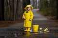 Child Enjoying The Rain In His Galoshes Royalty Free Stock Photo