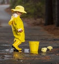 Child Enjoying The Rain In His Galoshes Royalty Free Stock Photo