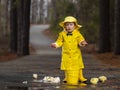 Child Enjoying The Rain In His Galoshes Royalty Free Stock Photo