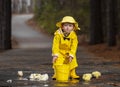 Child Enjoying The Rain In His Galoshes Royalty Free Stock Photo