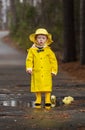 Child Enjoying The Rain In His Galoshes Royalty Free Stock Photo