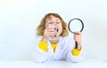 A child examines water with a magnifying glass. Selective focus. Royalty Free Stock Photo