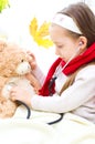 Child is examining her teddy bear Royalty Free Stock Photo