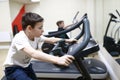 Child exercising on stationary bike