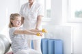 Child exercising with yellow dumbbells Royalty Free Stock Photo