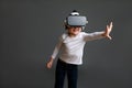 Child exploring digital virtual world with VR goggles