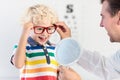 Child at eye sight test. Kid at optitian. Eyewear for kids. Royalty Free Stock Photo