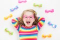 Child at eye sight test. Kid at optitian. Eyewear for kids. Royalty Free Stock Photo