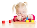 Child in eyeglases playing logical game isolated