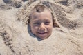 Child Face Buried Sand Royalty Free Stock Photo