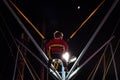 Child at a fair jumping on a Bungee Trampoline during the night Royalty Free Stock Photo