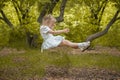 the child falls. fear of falling. growth in a dream. little girl in all whit Royalty Free Stock Photo
